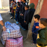 Distribution de vêtements chauds et bottes – Village d’Aglif